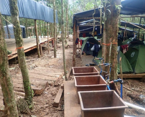 Figure 2. Papash camp boot washing station in the foreground to prevent mud from being traipsed into the living area - right- and the dining area - left
