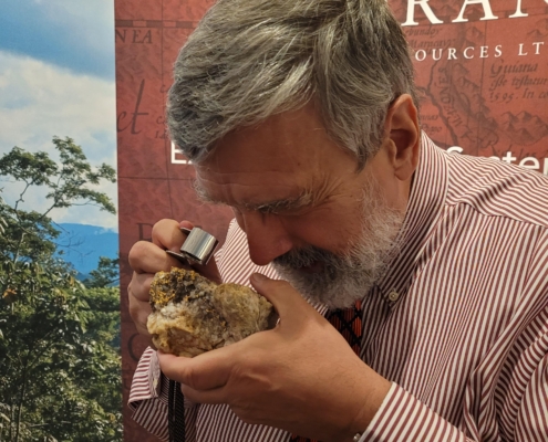 Keith Barron looking at high grade gold sample from France